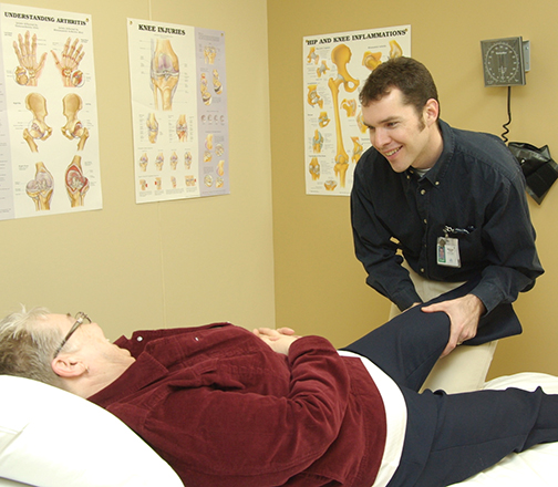 Physiotherapist works with a patient